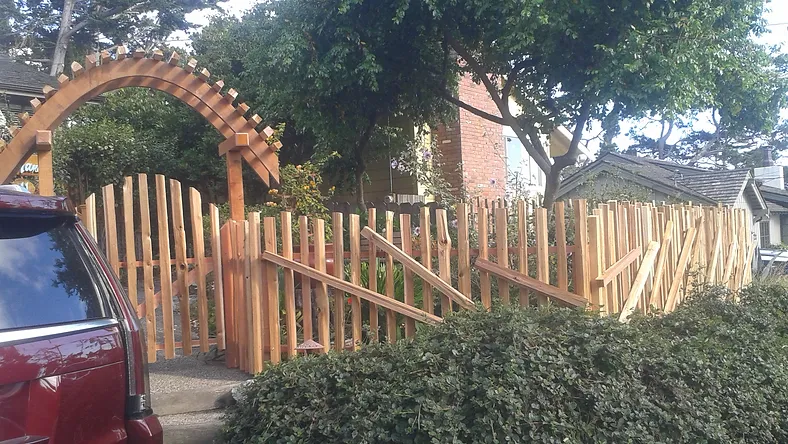 Fence Contractor Monterey exterior wooden fence with arched gage